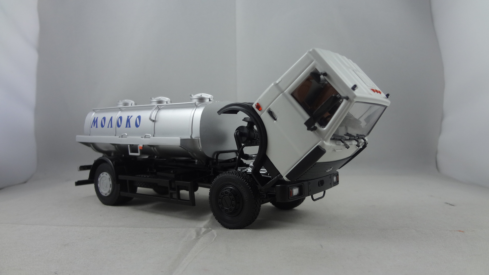 White cabine Maz truck with silver oil tanker model